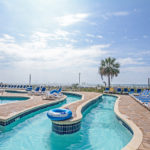 A winding oceanfront lazy river with inner tubes