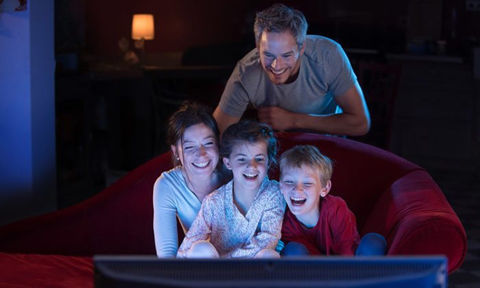 family watching movie on television